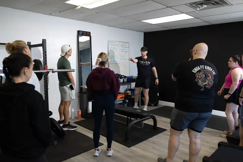 A coach leading a group training class at Haven Fit Club
